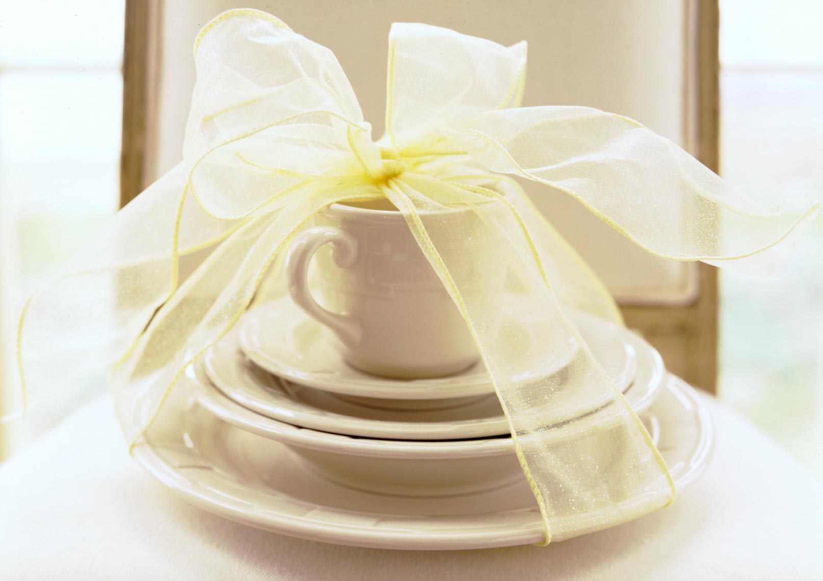 Dish set with yellow ribbon on top