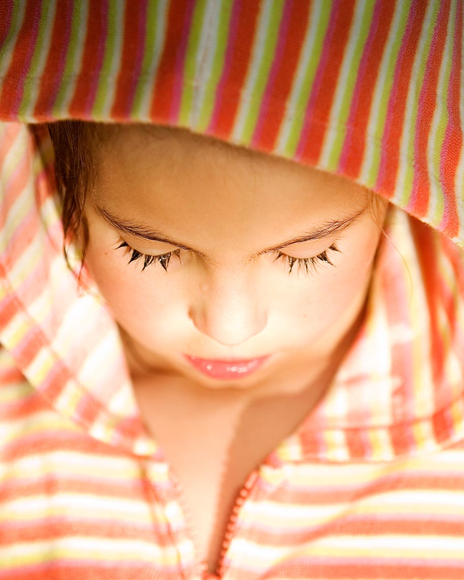 Natural light shot of young girl in sun recently out of the pool